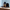 Looking into the Stars Large urn with four matching small Keepsakes and a black velvet carrying bag against a light blue wall
